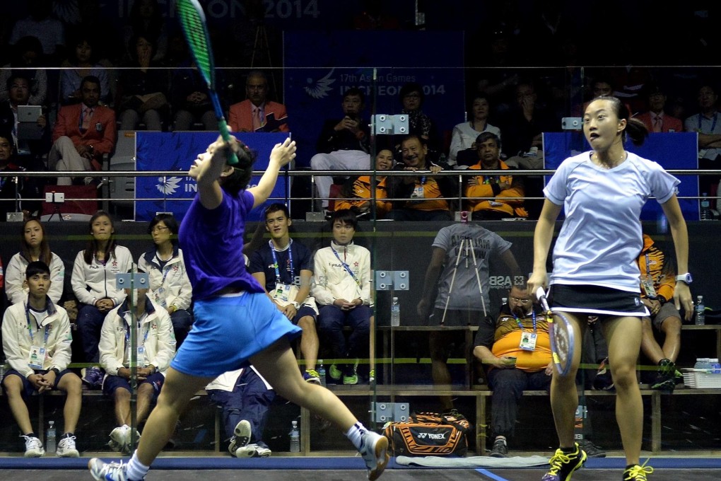 Hong Kong's Annie Au Wing-chi returns a shot in her semi-final game against Malaysia's Low Wee Wern in the glass court. Photo: AFP