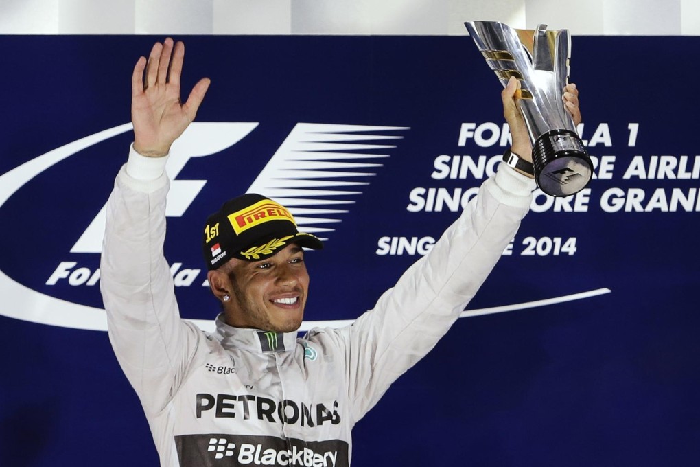 Lewis Hamilton savours his Singapore Grand Prix win. Photo: Reuters