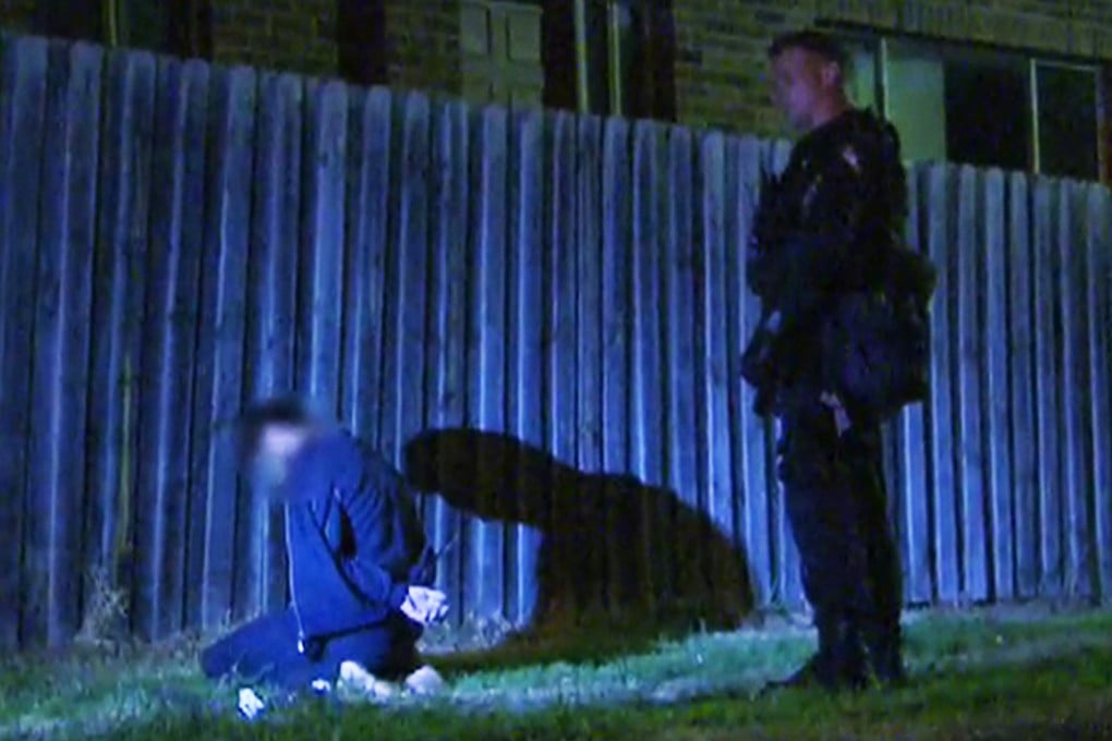 This still image taken from video shows a man detained by police during an anti-terrorism raid last week kneeling on the ground in Sydney. Photo: Reuters