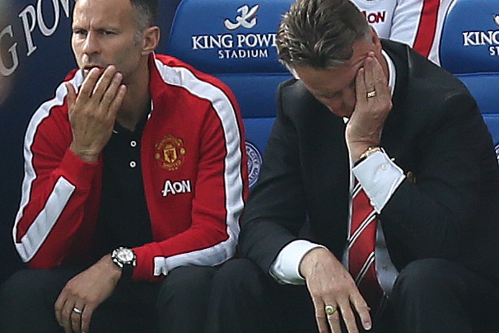 United manager Louis van Gaal and assistant Ryan Giggs can't believe what is happening in their match against Leicester. Photo: EPA