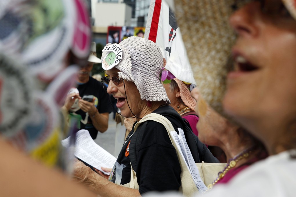 A group calling themselves the Raging Grannies sing protest songs as they join the climate march on Sunday in New York. Photo: AP