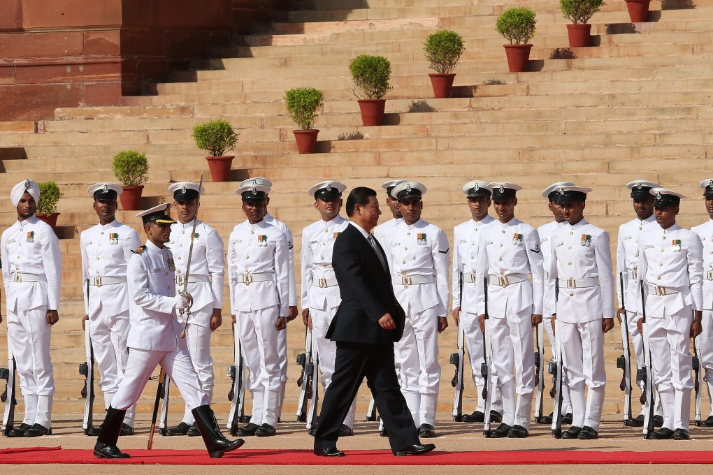 President Xi Jinping walks the red carpet at a welcome ceremony in New Delhi. Photo: EPA