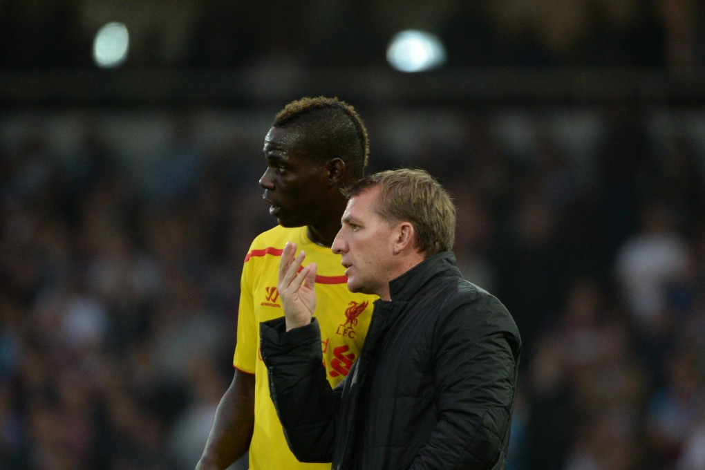 Liverpool manager Brendan Rodgers instructs Mario Balotelli in their match against  West Ham. Photo: EPA