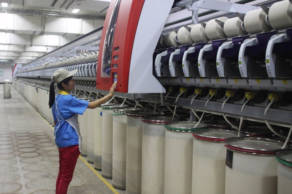 Factory output grew at the weakest pace in nearly six years in August. Photo: AFP