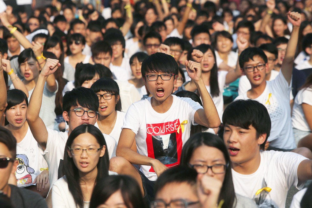 The students, mostly wearing white T-shirts, demand genuine universal suffrage at Chinese University yesterday. Photo: Sam Tsang