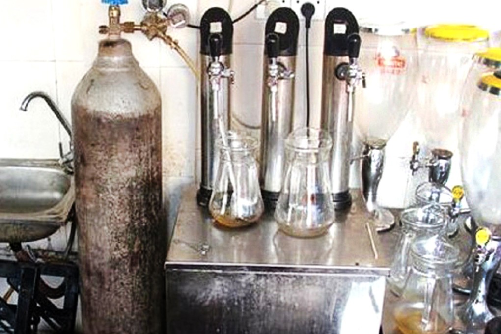 Industrial carbon dioxide was allegedly used by a gang in Guangdong to produce 480 tons of tainted beer since 2009. Photo: Guangzhou Daily