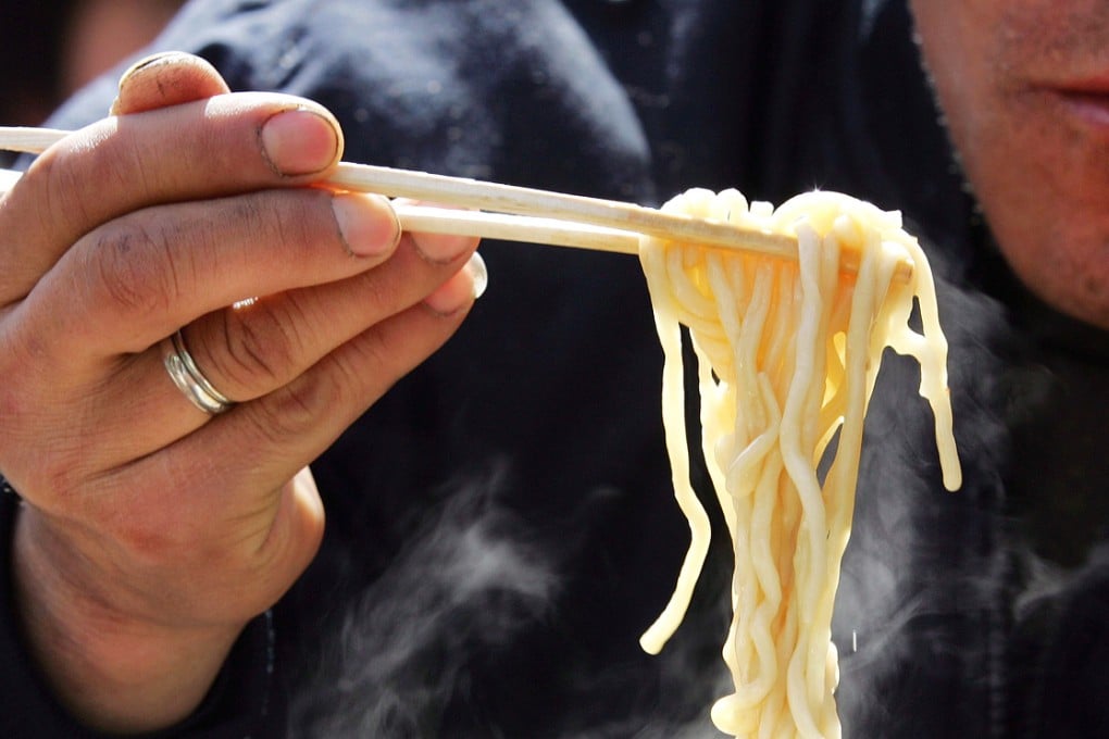 A Chinese man eats noodles at a restaurant in Beijing. Photo: AP