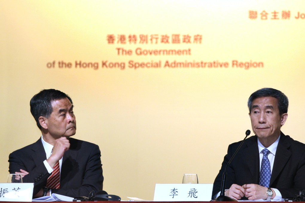 Hong Kong chief executive Leung Chun-ying and Li Fei, deputy secretary general of the NPC Standing Committee, explaining Beijing's stance. Photo: Dickson Lee