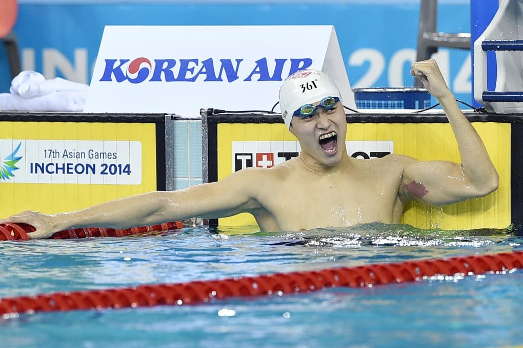 China's Sun Yang celebrates after winning the men's 400 metres freestyle gold medal. Photo: Xinhua