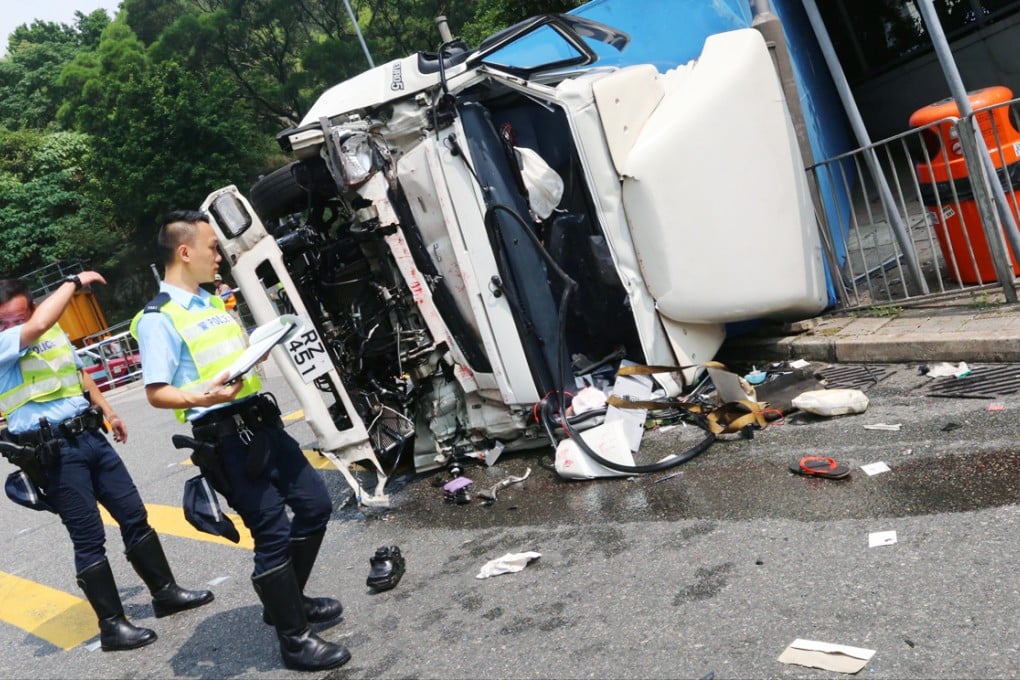 The truck smashed into a traffic island after rolling down the hill. Photo: David Wong