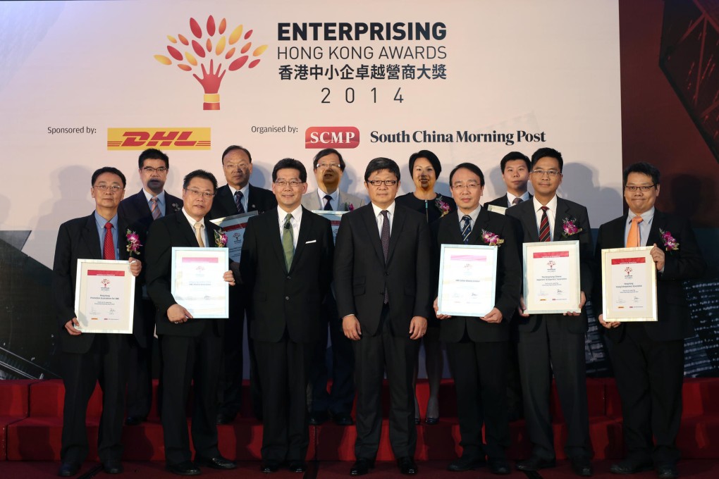 At the ceremony are (front row, from left) Anthony Chung, chairman of the Hong Kong Promotion Association for Small and Medium Enterprises; Ewins Chiu, founding executive vice-president of the Hong Kong Greater China SME Alliance Association; Greg So, Secretary for Commerce and Economic Development; Robin Hu, chief executive of SCMP Group; Tommy Lo, founding president of the SME Global Alliance; Michael Hui, vice-president of the Hong Kong Chinese Importers' and Exporters' Association; Gary Tong, chairman of the Hong Kong Young Entrepreneur Alliance; (second row, from left) Gary Lo, president of the Federation of International SME; Simon Cheung, chairman of Hong Kong (SME) Economic and Trade Promotional Association; Edward Lam, president of the Hong Kong SME Development Federation; Candy Liu of the Hong Kong Small and Medium Enterprises Association; and Sam Chan, 2014 national business director of the Junior Chamber International Hong Kong. Photo: Paul Yeung