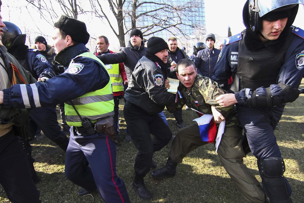 Police detain a pro-Russian demonstrator during a rally in Donetsk in March, 2014. Photo: Reuters