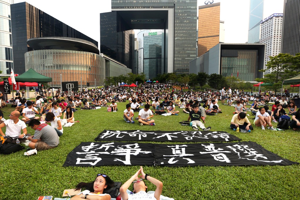 Hundreds of students sit at the open area of Tamar Park as they boycott class. Photo: Sam Tsang