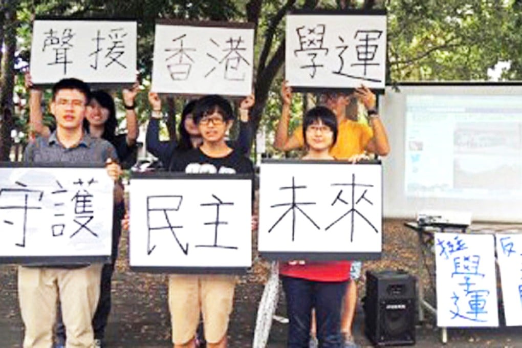 Taiwanese students hold up placards supporting Hong Kong students' class boycotts. Photo: SCMP Pictures