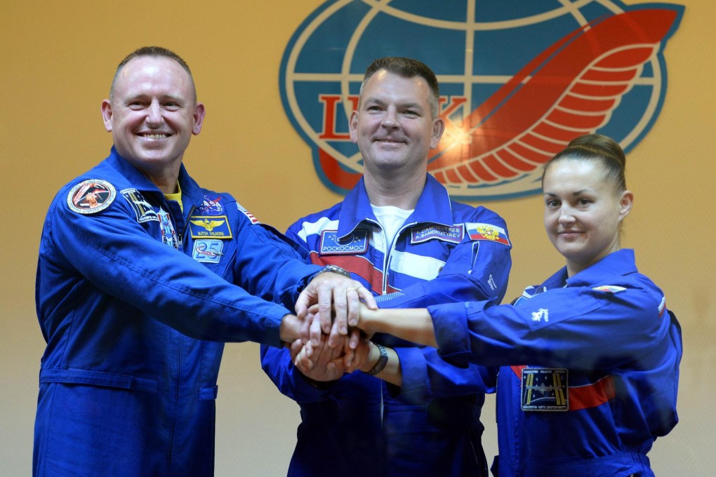 US astronaut Barry Wilmore and Russian cosmonauts Alexander Samokutyaev and Yelena Serova at the Baikonur cosmodrome. Photo: AFP