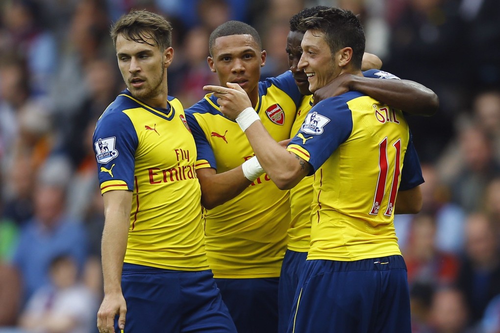 Mesut Ozil (right) and his Arsenal teammates host Tottenham on Saturday. The Gunners have the best chance of taking the points. Photo: Reuters