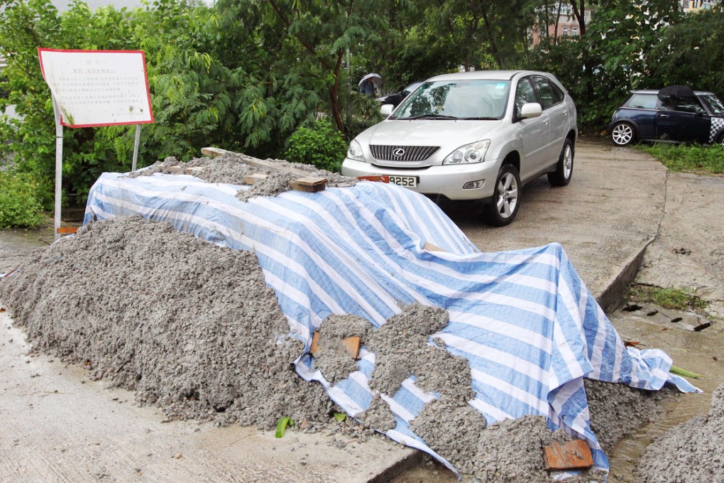 A pile of rubble sits across a three-metre-wide lane blocking access into Ho Chung New Village in Sai Kung. Photo: Edward Wong