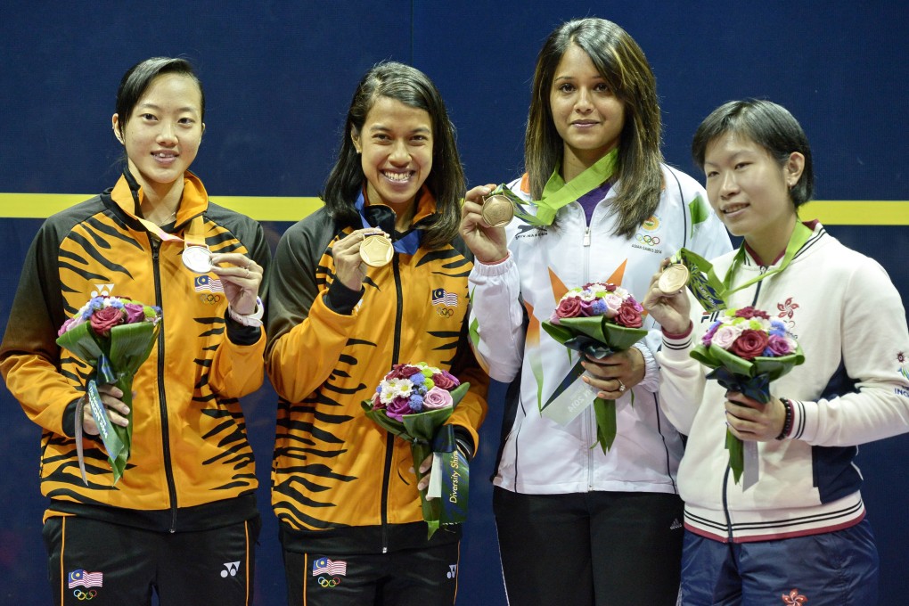 Silver medallist Low Wee Wern of Malaysia, gold medallist Nicol Ann David and bronze medallists India's Rebecca Pallikal Dipka and Hong Kong's Annie Au Wing-chi. Photo: AP