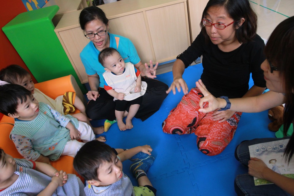 Lee Chun-hey (being held) attends a class. Photo: Edward Wong