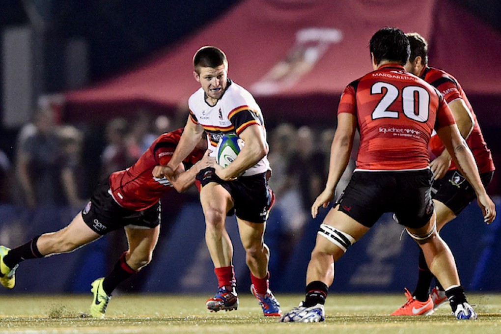 Jason Kjestrup, man of the match on his debut for HKCC in the late game, looks for a way past the Valley defence. Photos: HKRFU