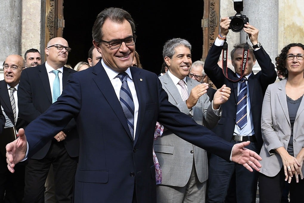 President of Catalonia's regional government Artur Mas gestures after signing the regional law to vote on independence on Saturday. Photo: AFP