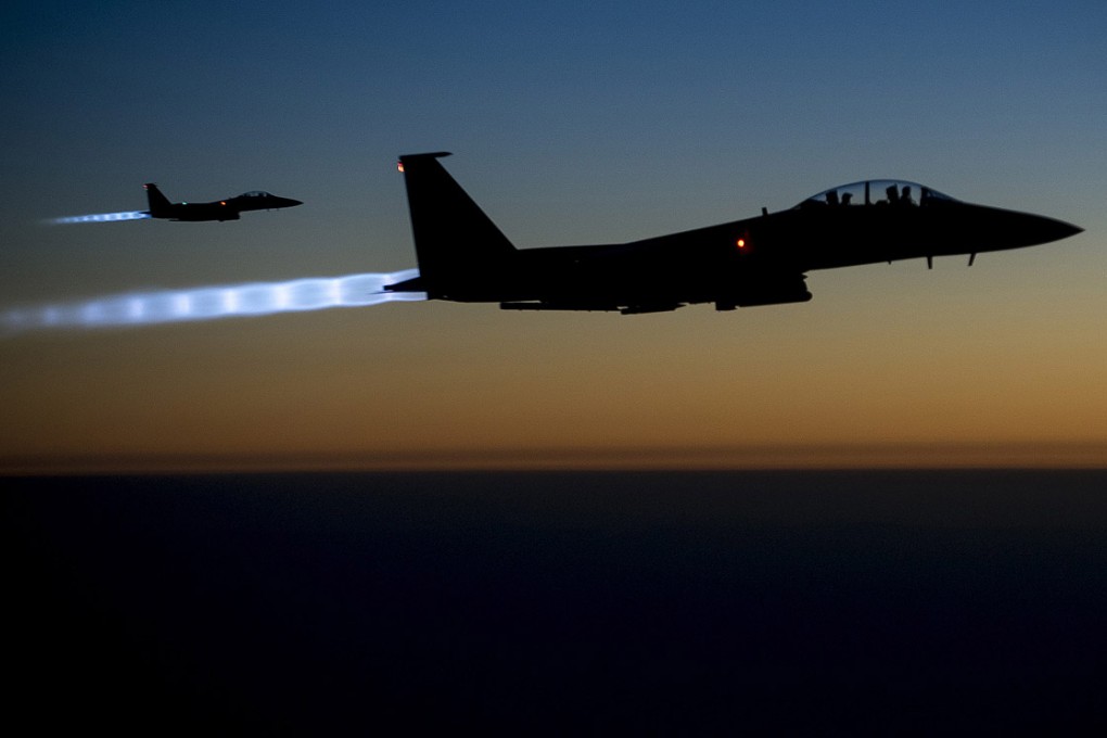 A pair of US Air Force F-15E Strike Eagles jet fighters fly over northern Iraq. Photo: Reuters