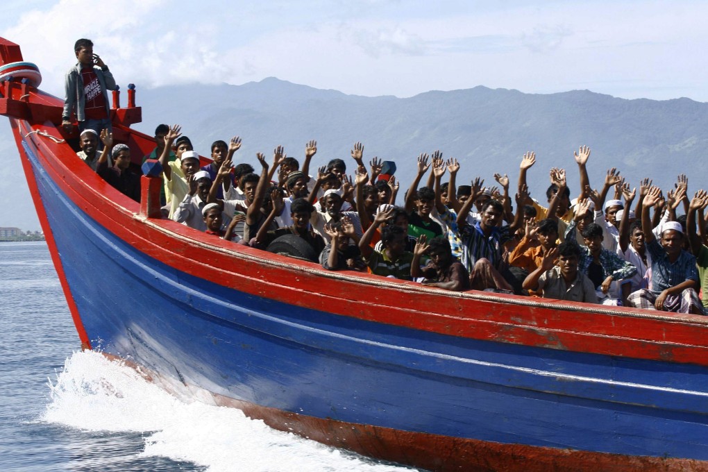 Ethnic Rohingya refugees from Myanmar being transported by boat to a temporary shelter in Krueng Raya. Photo: Reuters
