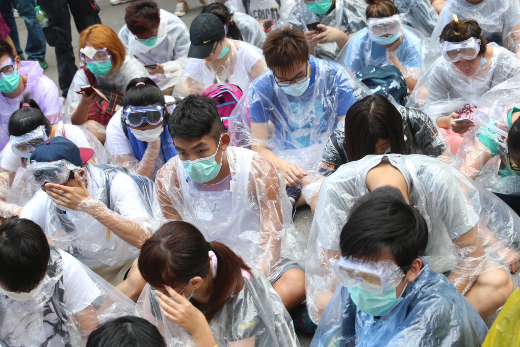 Protesters wear goggles, face masks and raincoats as defence against pepper spray. Others have created anti-pepper spray barriers out of umbrellas.