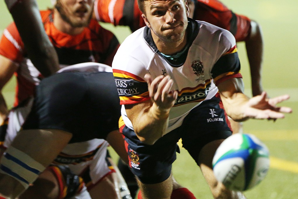 Liam Slatem from Leighton Asia HKCC passes to a teammate in their opening Super Saturday rugby match at King's Park, Ho Man Tin. Photos: KY Cheng