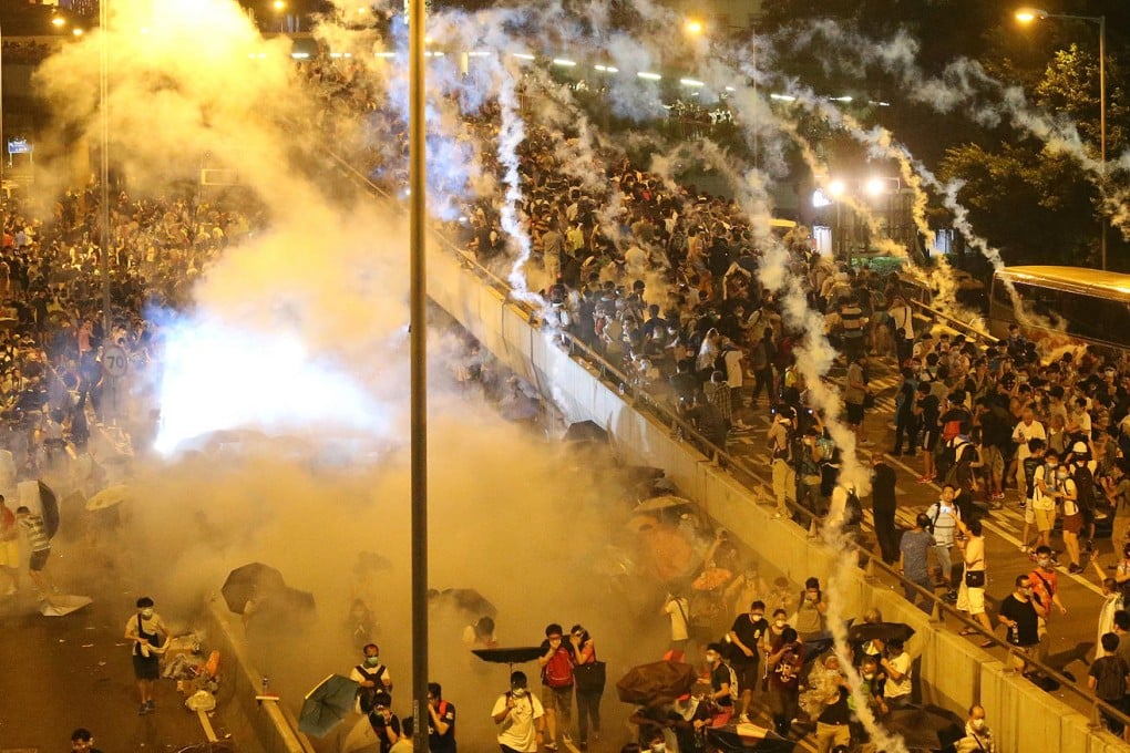 Police in riot gear fire tear gas at Occupy Central protesters in Connaught Road Central, Admiralty. Yesterday was the first time gas had been deployed by Hong Kong police since 2005. Photo: K.Y. Cheng