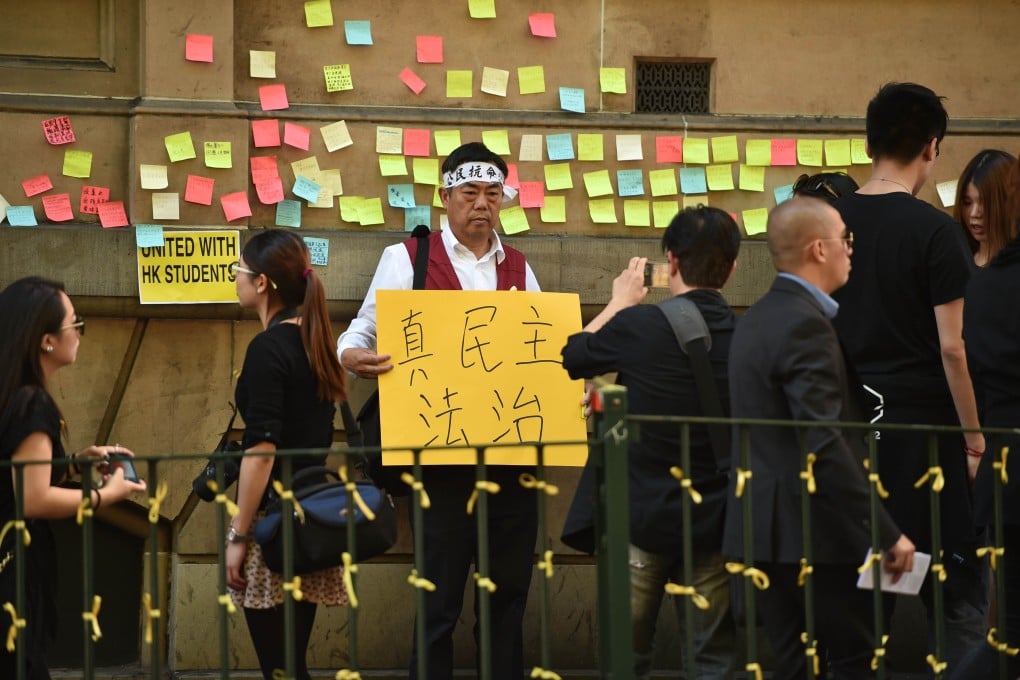 Supporters of the thousands of protesters who paralysed parts of Hong Kong to demand greater democracy from Beijing gather in Sydney on September 29, 2014. Photo: AFP