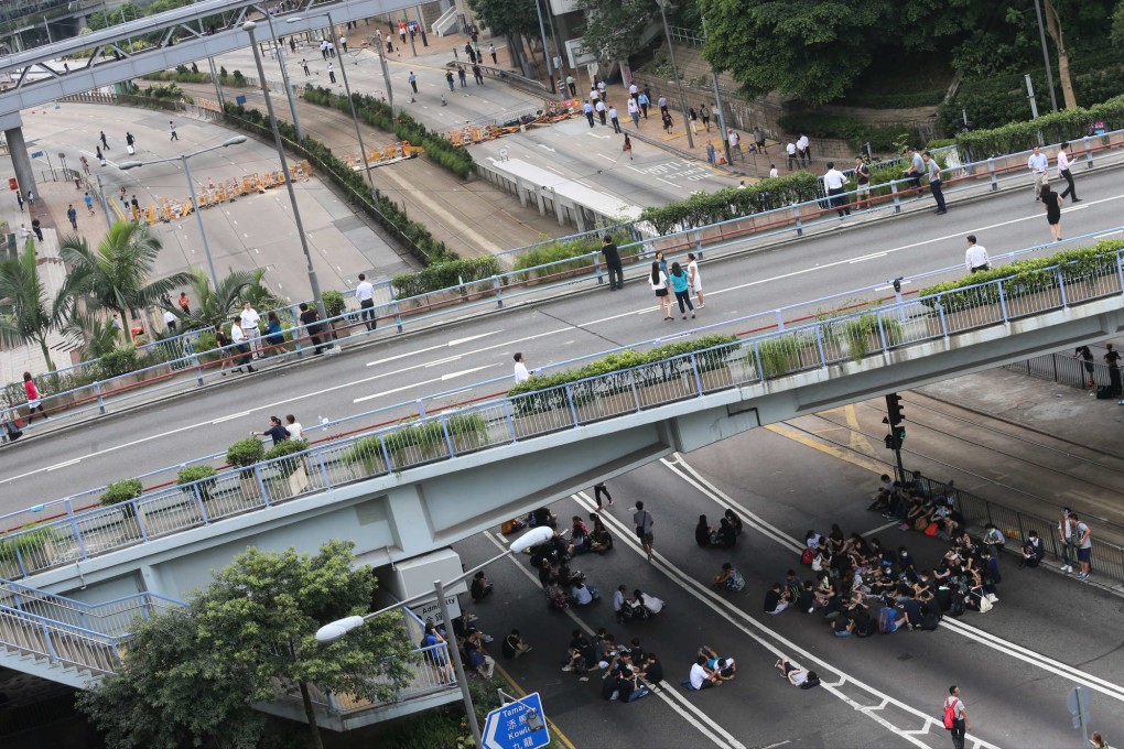 An aerial view of largely empty streets blocked by small numbers of protesters in Central around noon on Monday, September 29. Photo: David Wong/SCMP