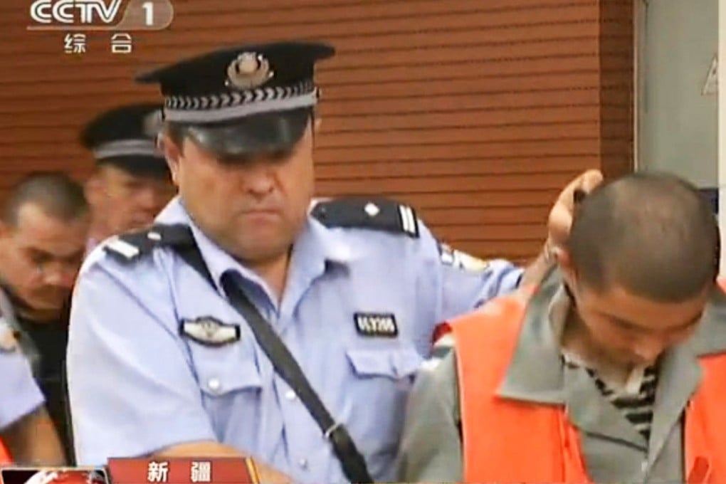 One of the accused is shown on state television in court in Kashgar. Photo: SCMP Pictures