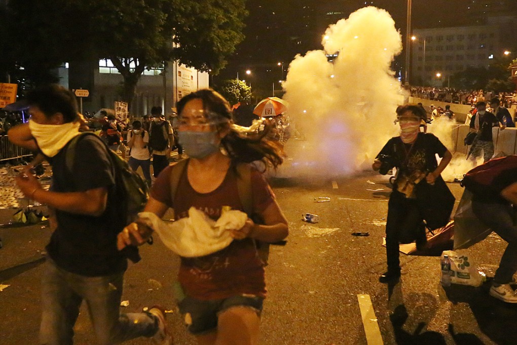 The police fire tear gas to protesters in Admiralty. Photo: Sam Tsang