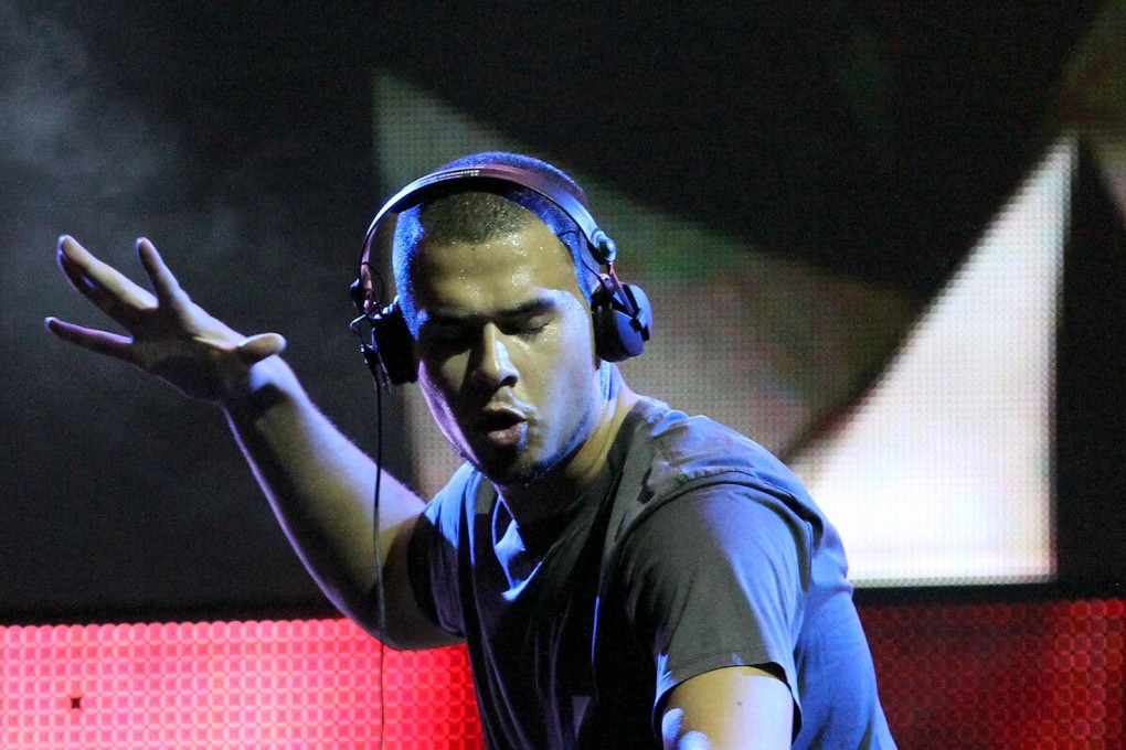 Dutch DJ Afrojack on the decks in Miami. Photos: AP, AFP