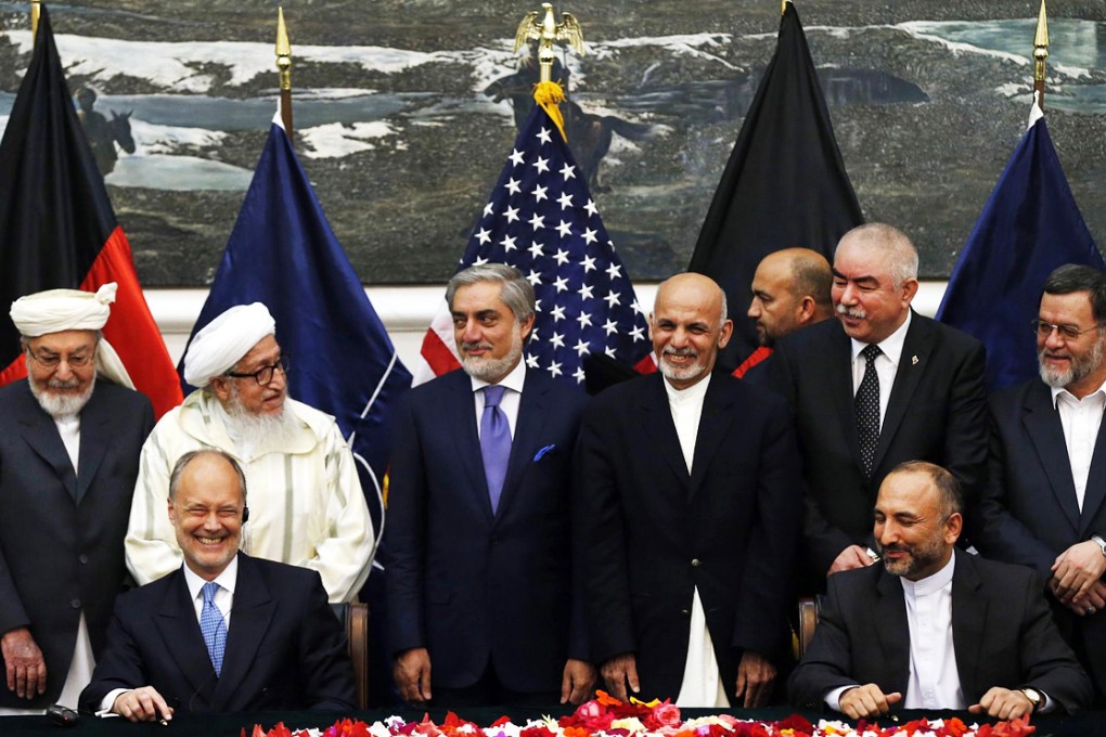 Atmar (front right) and Cunningham (left) in Kabul. Photo: Reuters