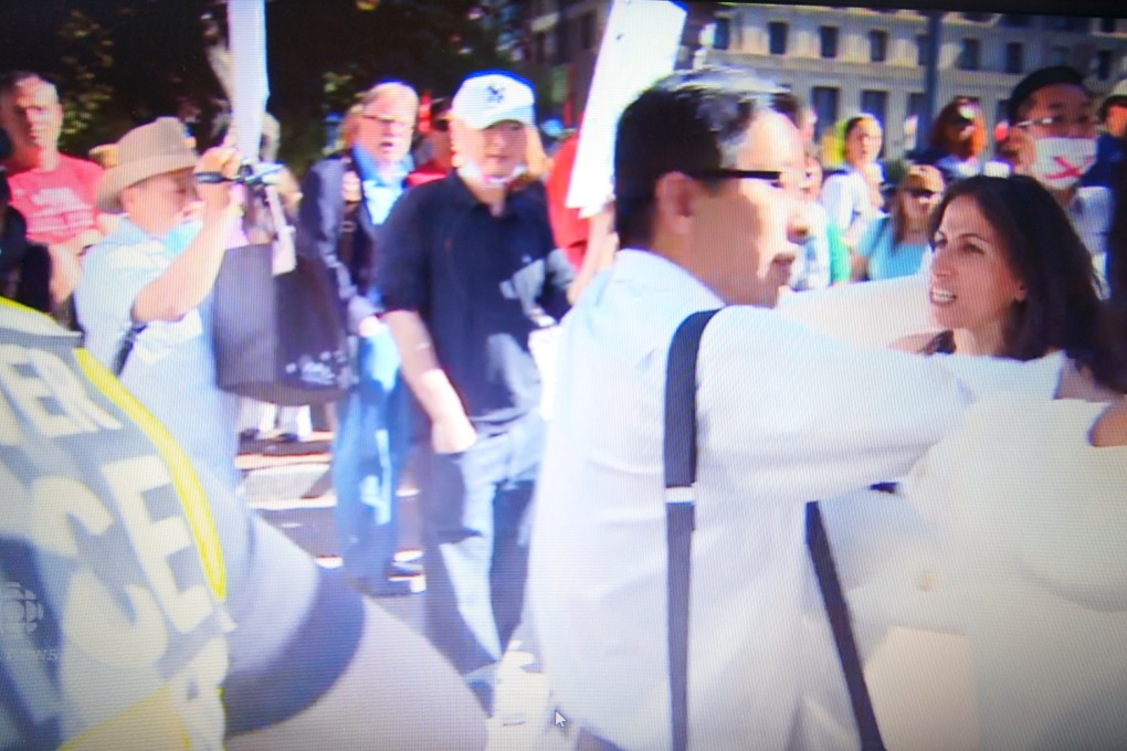 A member of the BC Parents’ Federation and a striking teacher scuffle at a September 14 protest in Vancouver. Photo: CBC