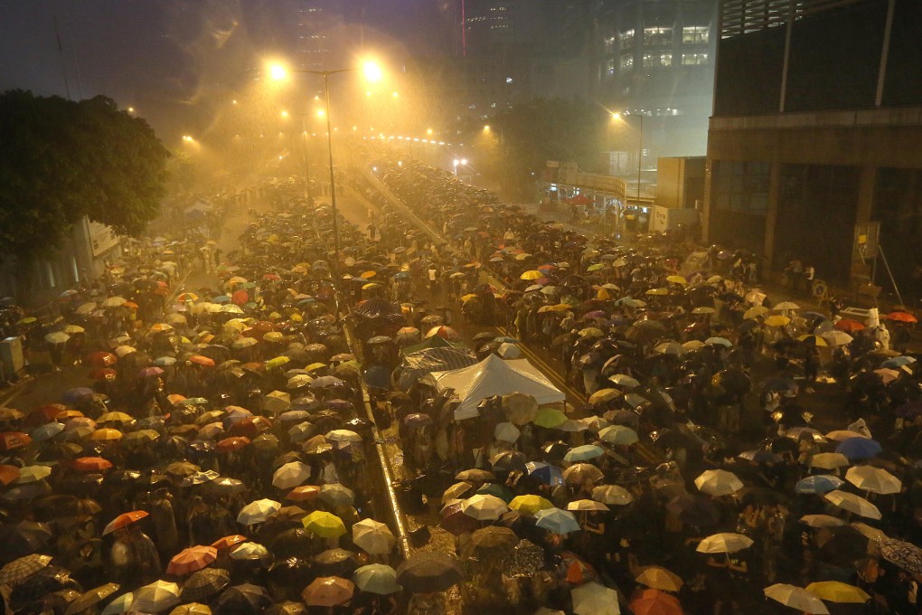 Occupy Central protesters in the rain in Admiralty. Photo: Felix Wong