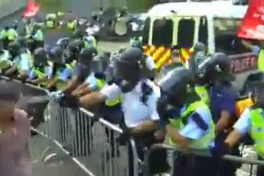 Videos of police pepper-spraying a middle-aged man tell different stories. Photo: SCMP Pictures
