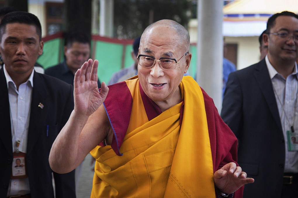 Tibetan spiritual leader the Dalai Lama greets devotees as he arrives at a temple for a religious talk in Dharamsala, India last week. Photo: AP