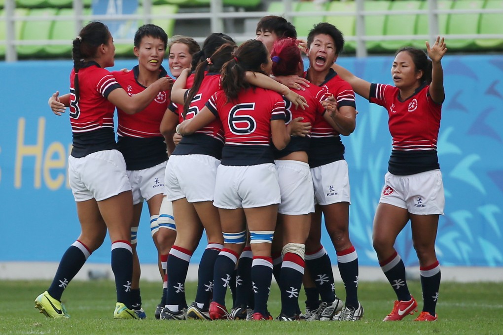 Hong Kong celebrate their victory over Kazakhstan, putting them top of their pool and setting up a semi-final clash with Japan. Photos: Nora Tam/SCMP