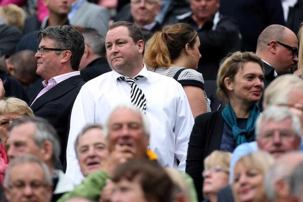 Newcastle United owner Mike Ashley (centre) watches from the stands during their match against Hull City at St James’ Park. Photo: AP