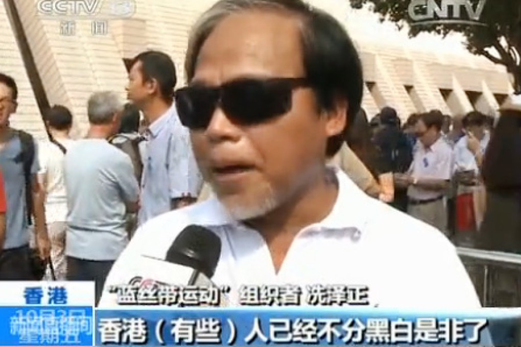 A still from today's CCTV reportage showing an anti-occupy protester comments about the movement in Hong Kong.