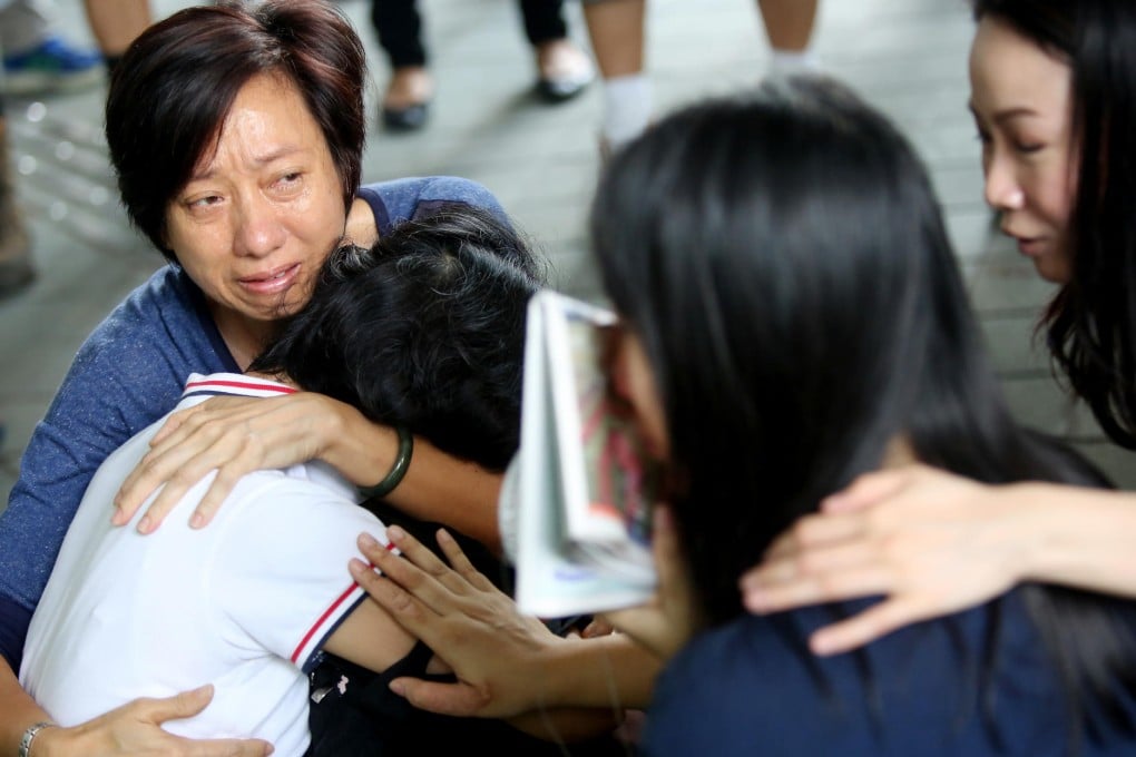 Weeping contract staff who lost a day's pay because of the Tamar blockade. Photo: Sam Tsang