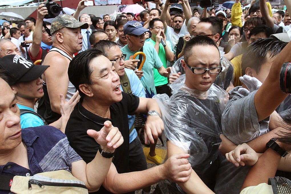 The anti-Occupy group make their views heard in Mong Kok. Photo: May Tse