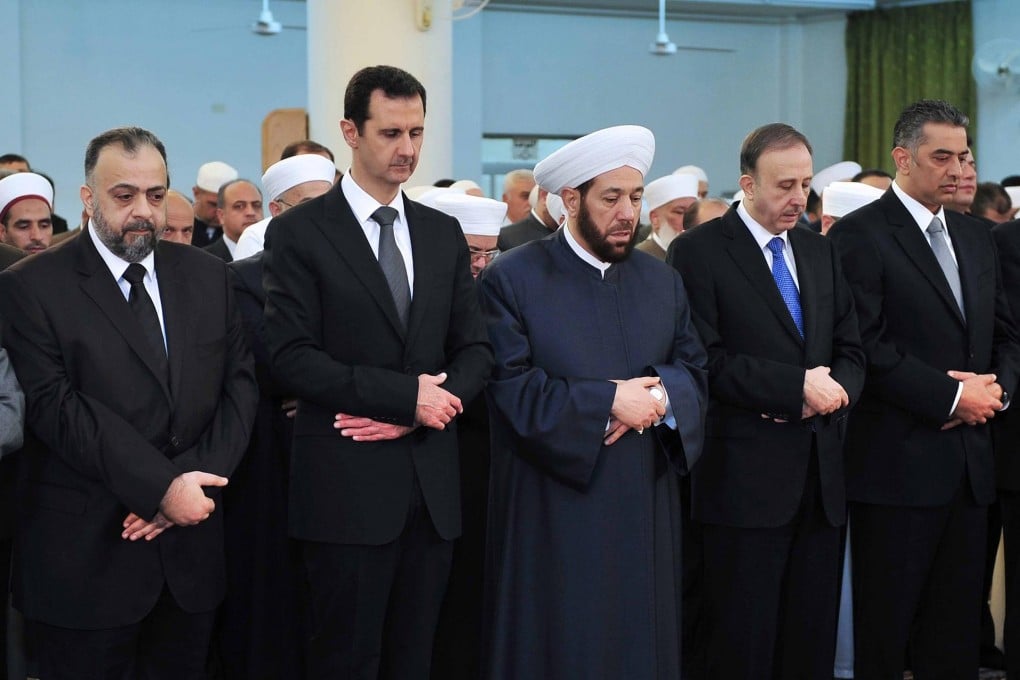 Syrian President Bashar al-Assad attends Eid ul-Adha prayers yesterday. Photo: Reuters
