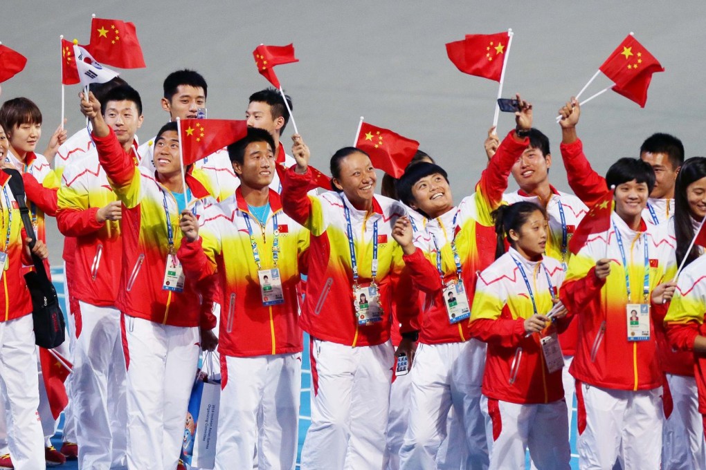 Chinese athletes celebrate the nation's victory after it came out on top in the Asian Games yesterday. Photo: Xinhua