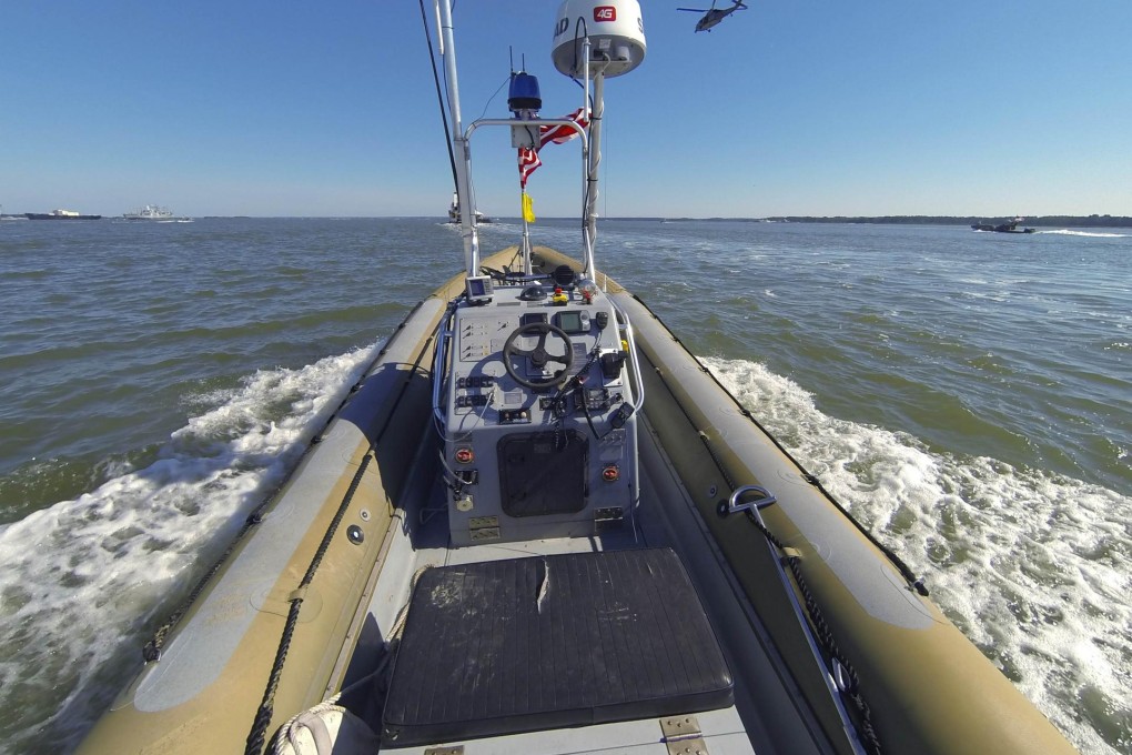 An unmanned boat operates during trials on the James River in Virginia. The testing has been hailed as a success by the navy. Photo: Reuters