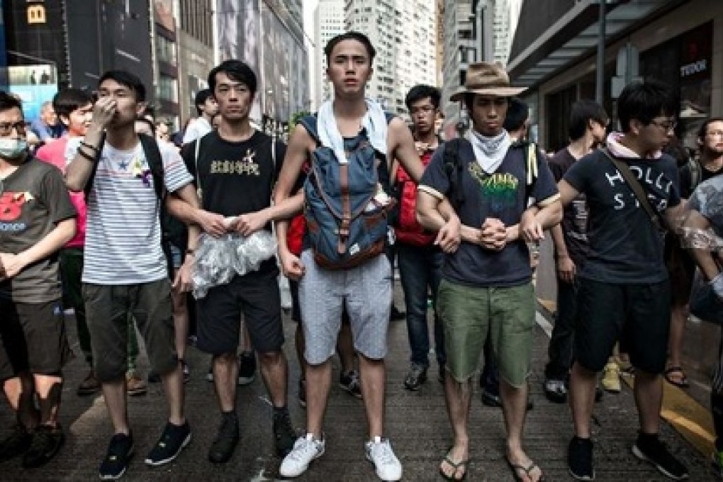 A human chain of student protestors to keep the peace. Photo: SCMP