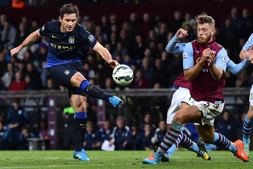 Manchester City's Frank Lampard takes an unsuccessful shot on the Aston Villa goal. Photo: AFP